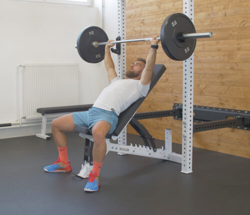 Bench press on an exercise bench